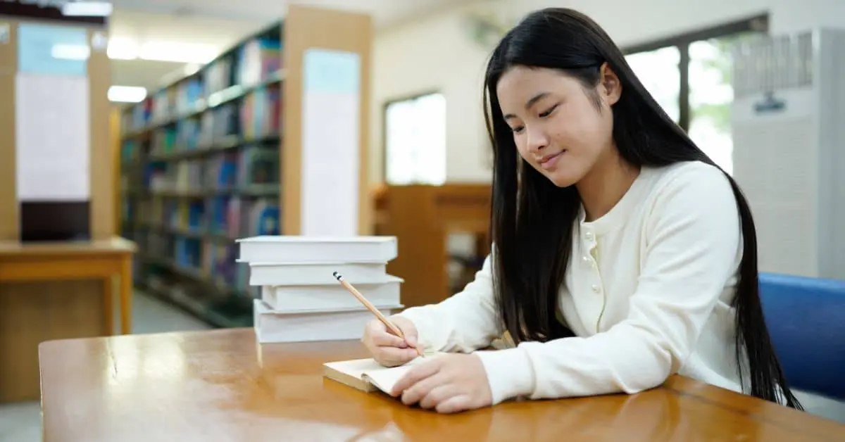Student studying biology terminology using notes